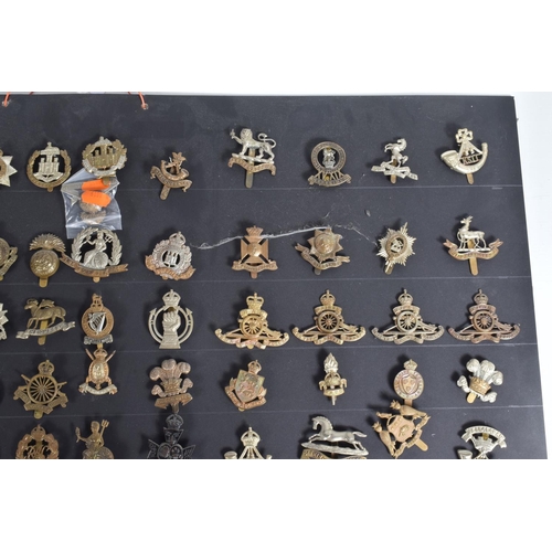 267 - A COLLECTION OF OVER ONE HUNDRED CAP AND COLLAR BADGES FROM VARIOUS ERAS OF THE 20TH CENTURY, this v... 