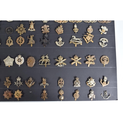 267 - A COLLECTION OF OVER ONE HUNDRED CAP AND COLLAR BADGES FROM VARIOUS ERAS OF THE 20TH CENTURY, this v... 