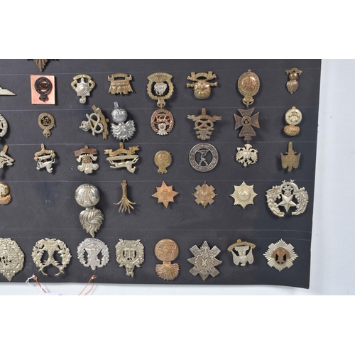 268 - A COLLECTION OF OVER ONE HUNDRED MILITARY CAP AND COLLAR BADGES FROM VARIOUS ERAS OF THE 20TH CENTUR... 