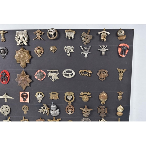 268 - A COLLECTION OF OVER ONE HUNDRED MILITARY CAP AND COLLAR BADGES FROM VARIOUS ERAS OF THE 20TH CENTUR... 