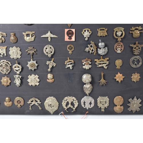 268 - A COLLECTION OF OVER ONE HUNDRED MILITARY CAP AND COLLAR BADGES FROM VARIOUS ERAS OF THE 20TH CENTUR... 