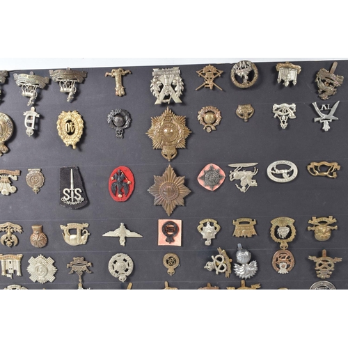 268 - A COLLECTION OF OVER ONE HUNDRED MILITARY CAP AND COLLAR BADGES FROM VARIOUS ERAS OF THE 20TH CENTUR... 