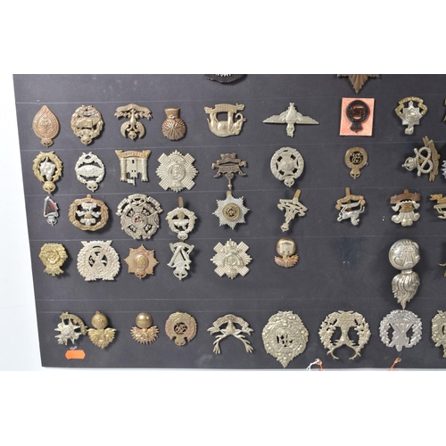 268 - A COLLECTION OF OVER ONE HUNDRED MILITARY CAP AND COLLAR BADGES FROM VARIOUS ERAS OF THE 20TH CENTUR... 