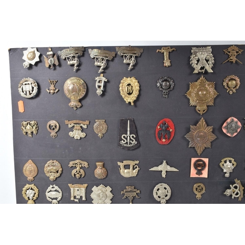 268 - A COLLECTION OF OVER ONE HUNDRED MILITARY CAP AND COLLAR BADGES FROM VARIOUS ERAS OF THE 20TH CENTUR... 