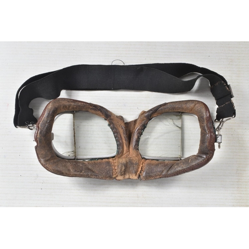 280 - A LEATHER RAF MID WWII LEATHER FLYING HELMET, together with goggles, The main construction of the he... 