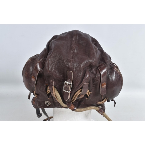 280 - A LEATHER RAF MID WWII LEATHER FLYING HELMET, together with goggles, The main construction of the he... 