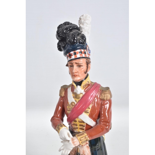 296 - A CERAMIC FIGURE OF A NAPOLEONIC WARS SCOTTISH FOOT SOLDIER, believed to be of German manufacture fo... 