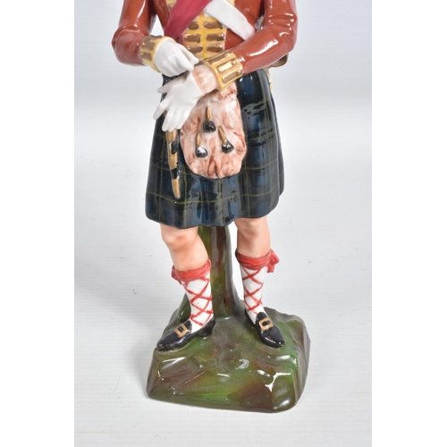 296 - A CERAMIC FIGURE OF A NAPOLEONIC WARS SCOTTISH FOOT SOLDIER, believed to be of German manufacture fo... 