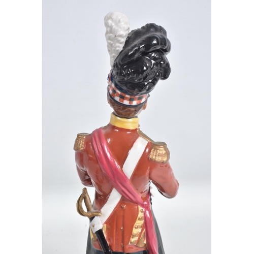 296 - A CERAMIC FIGURE OF A NAPOLEONIC WARS SCOTTISH FOOT SOLDIER, believed to be of German manufacture fo... 