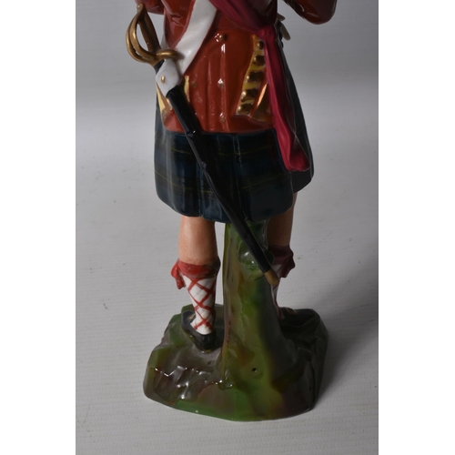 296 - A CERAMIC FIGURE OF A NAPOLEONIC WARS SCOTTISH FOOT SOLDIER, believed to be of German manufacture fo... 