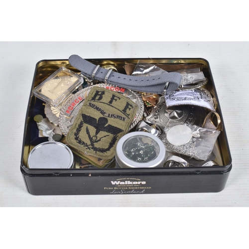 301 - TWO TINS CONTAINING ITEMS OF MILITARY INTEREST, inc pin badges, patches, belt buckle, other badges, ... 