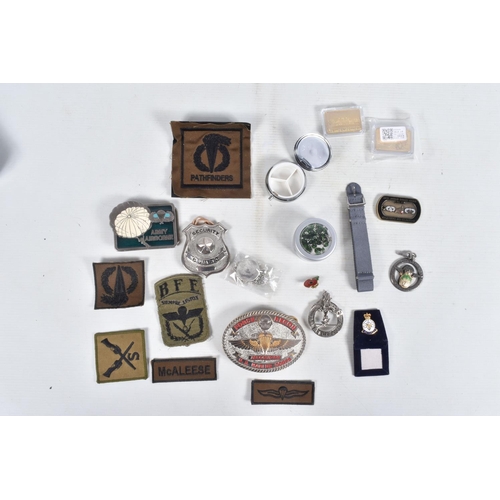 301 - TWO TINS CONTAINING ITEMS OF MILITARY INTEREST, inc pin badges, patches, belt buckle, other badges, ... 