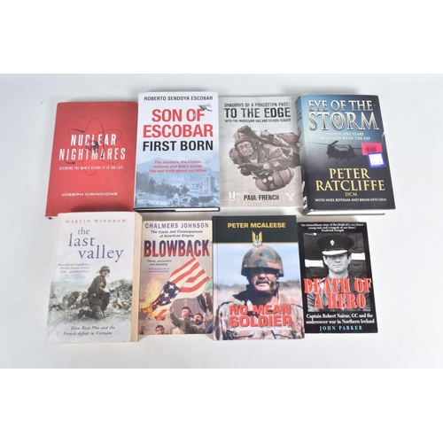 307 - A BOX OF MILITARY RELATED BOOKS BOTH HARD & SOFTBACK, together with four signed photos by Peter McAl... 