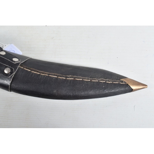 329 - A KUKRI STYLE KNIFE IN ITS ORIGINAL SHEAF, the blade is not decorated and shows some age related wea... 