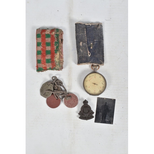 330 - A BOX OF ASSORTED MILITARIA, including canvas belts and holsters, three strung dog tags for 10571193... 