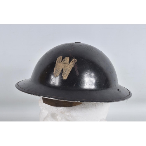 331 - A BOX OF 20TH CENTURY MILITARIA, including an air Raid warden's helmet, a brass shell fuse, a small ... 