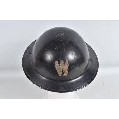 331 - A BOX OF 20TH CENTURY MILITARIA, including an air Raid warden's helmet, a brass shell fuse, a small ... 