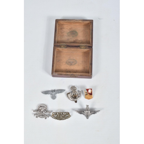 331 - A BOX OF 20TH CENTURY MILITARIA, including an air Raid warden's helmet, a brass shell fuse, a small ... 