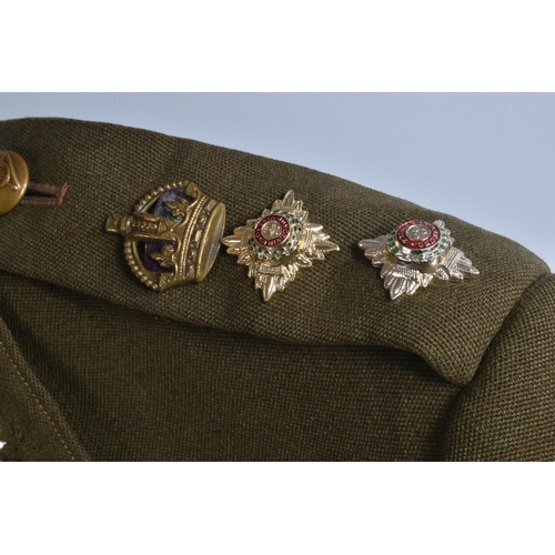 333 - A VINTAGE SUITCASE CONTAINING A QUANTITY OF DRESS UNIFORMS, these include a size 22 Royal Marines ja... 