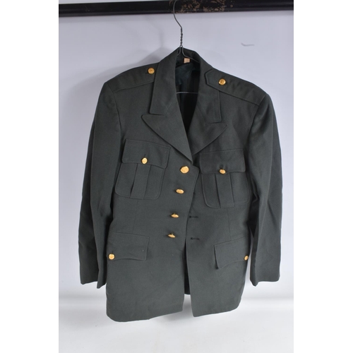 335 - A QUANTITY OF AMERICAN DRESS UNIFORM JACKETS AND SOME TROUSERS, two of the jackets have buttons on t... 