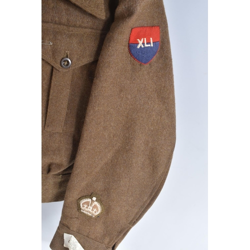 336 - A 1946 PATTERN BRITISH BATTLEDRESS BLOUSE WITH 41st ARMY GROUP RA INSIGNIA, the jacket is size 6 and... 