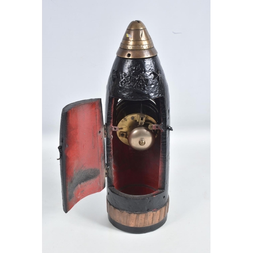 340 - A TRENCH ART MANTLE CLOCK FORMED FROM A BOMB CASING, 19th century movement free from the case, damag... 