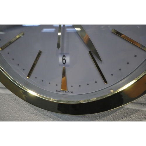 1201 - A PATEK PHILIPPE GENEVE DEALERS ADVERTISING WALL CLOCK, with a brassed frame, and a grey dial, diame... 