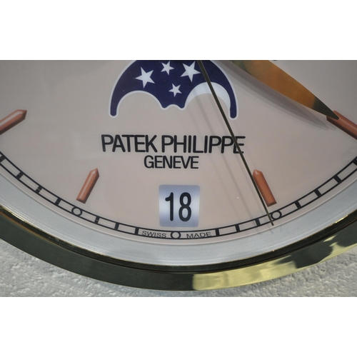 1202 - A PATEK PHILIPPE GENEVE DEALERS ADVERTISING WALL CLOCK, with a brassed frame, and a cream dial, diam... 