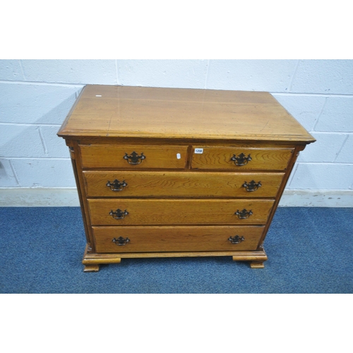 1208 - A 20TH CENTURY GEORGIAN STYLE OAK CHEST OF TWO SHORT OVER THREE LONG DRAWERS, with reeded front corn... 