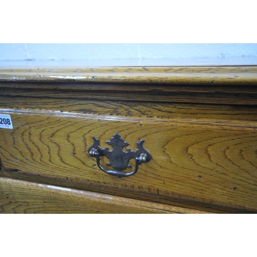 1208 - A 20TH CENTURY GEORGIAN STYLE OAK CHEST OF TWO SHORT OVER THREE LONG DRAWERS, with reeded front corn... 