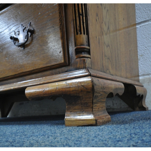 1208 - A 20TH CENTURY GEORGIAN STYLE OAK CHEST OF TWO SHORT OVER THREE LONG DRAWERS, with reeded front corn... 