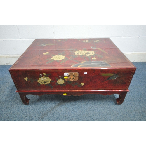 1212 - A 20TH CENTURY RED LACQUER AND CHINOISERIE MARRIAGE CHEST, depicting a variety of flowers and birds,... 