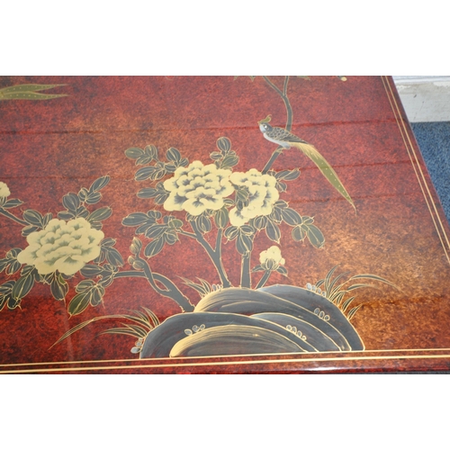 1212 - A 20TH CENTURY RED LACQUER AND CHINOISERIE MARRIAGE CHEST, depicting a variety of flowers and birds,... 