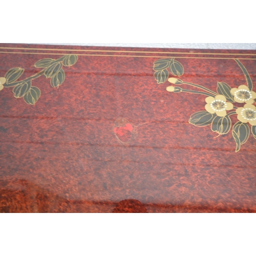 1212 - A 20TH CENTURY RED LACQUER AND CHINOISERIE MARRIAGE CHEST, depicting a variety of flowers and birds,... 