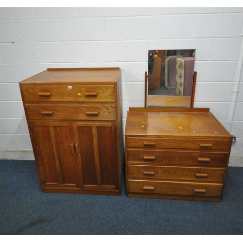 1214 - A 20TH CENTURY OAK TWO PIECE BEDROOM SUITE, comprising a cabinet with two drawers, above double cupb... 