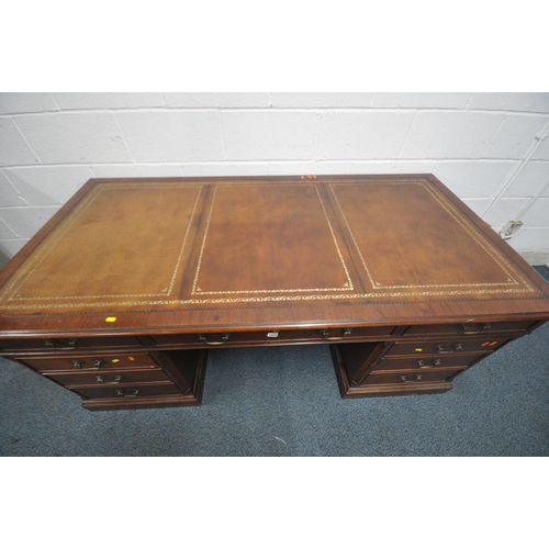 1225 - A LARGE MAHOGANY TWIN PEDESTAL DESK, with a tanned leather writing surface, eight assorted drawers, ... 