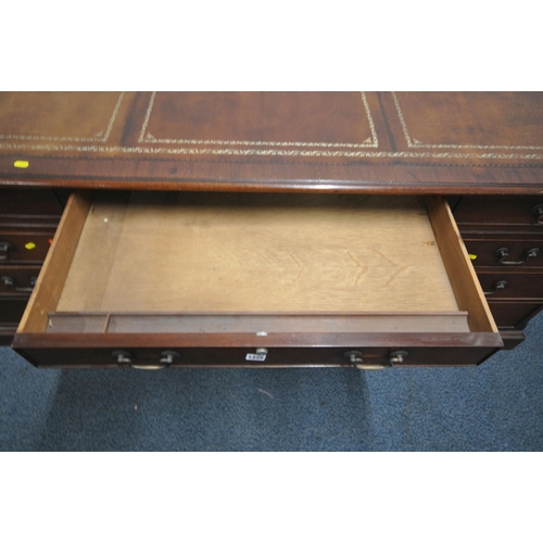 1225 - A LARGE MAHOGANY TWIN PEDESTAL DESK, with a tanned leather writing surface, eight assorted drawers, ... 