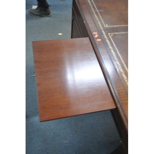 1225 - A LARGE MAHOGANY TWIN PEDESTAL DESK, with a tanned leather writing surface, eight assorted drawers, ... 