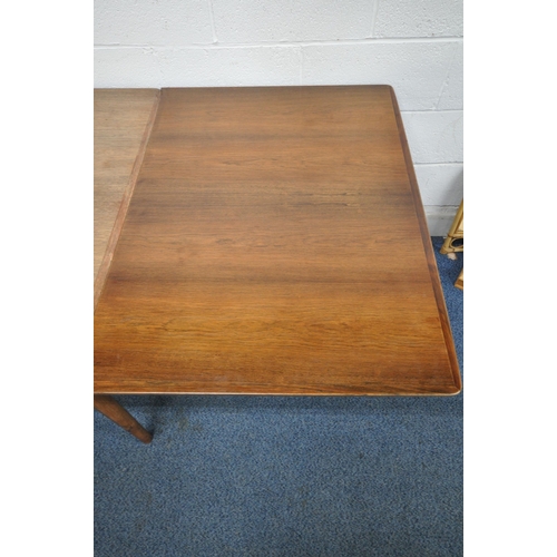 1233 - A MID CENTURY DANISH ROSEWOOD DRAW LEAF DINING TABLE, raised on cylindrical tapered legs, extended l... 