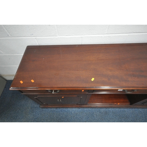 1237 - A LATE 20TH CENTURY MAHOGANY SIDEBOARD, fitted with three drawers, above four cupboard doors, length... 