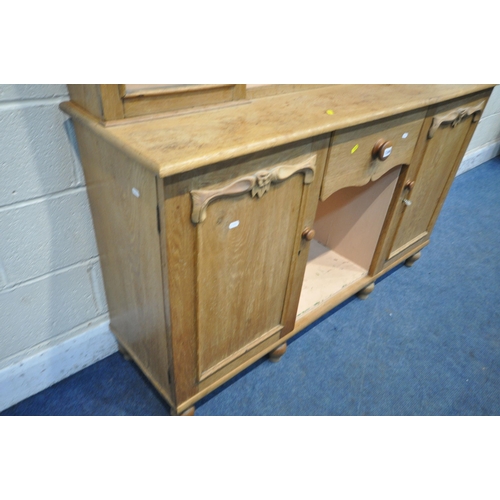 1249 - A 19TH CENTURY OAK DRESSER, the four tier plate rack, flanked by two glass doors, atop a base with t... 