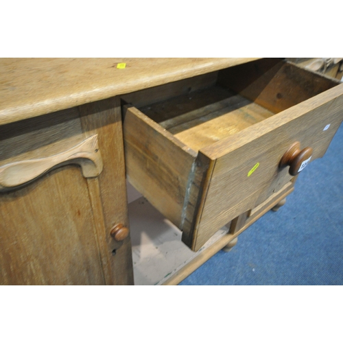 1249 - A 19TH CENTURY OAK DRESSER, the four tier plate rack, flanked by two glass doors, atop a base with t... 