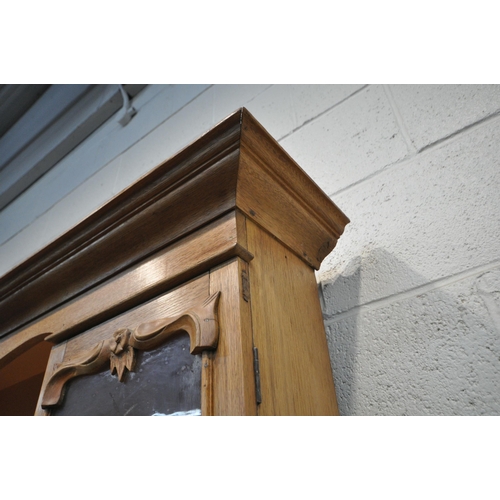 1249 - A 19TH CENTURY OAK DRESSER, the four tier plate rack, flanked by two glass doors, atop a base with t... 