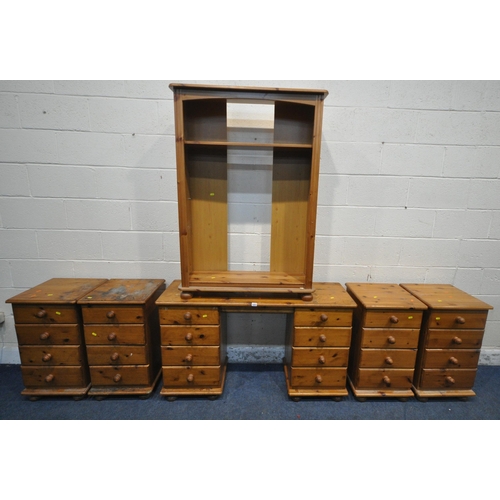 1251 - A SELECTION OF MODERN PINE FURNITURE, to include a desk, fitted with eight drawers, width 127cm x de... 