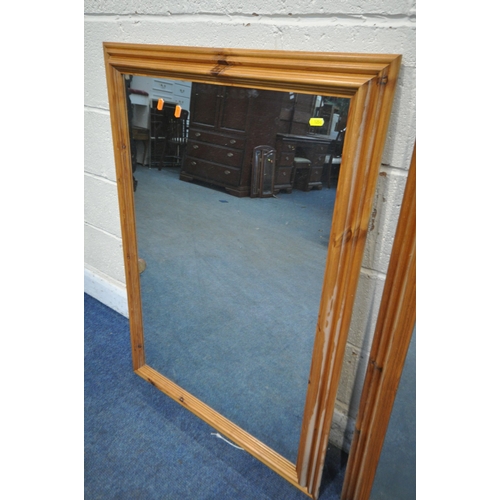 1256 - A LARGE PINE RECTANGULAR WALL MIRROR, 136cm x 104cm, along with a matching smaller mirror (condition... 