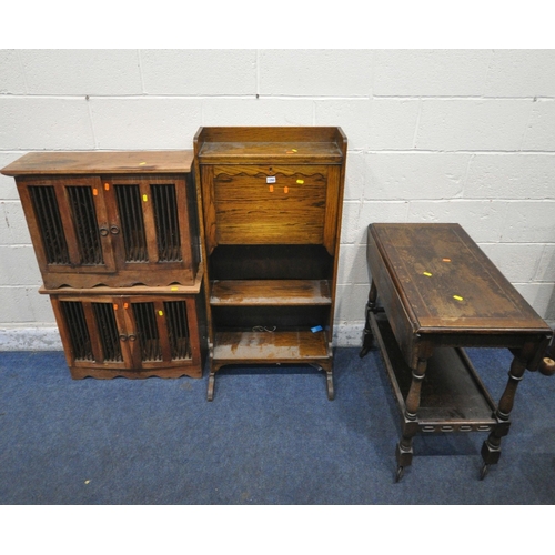 1260 - A 20TH CENTURY OAK STUDENTS BUREAU, the fall front door with a fitted interior, above two shelves, w... 