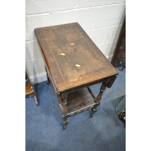 1260 - A 20TH CENTURY OAK STUDENTS BUREAU, the fall front door with a fitted interior, above two shelves, w... 