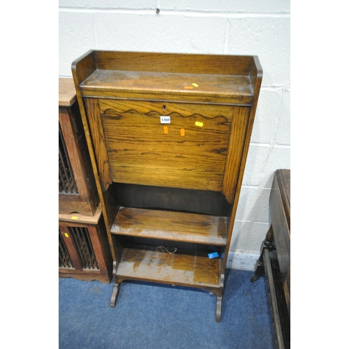 1260 - A 20TH CENTURY OAK STUDENTS BUREAU, the fall front door with a fitted interior, above two shelves, w... 