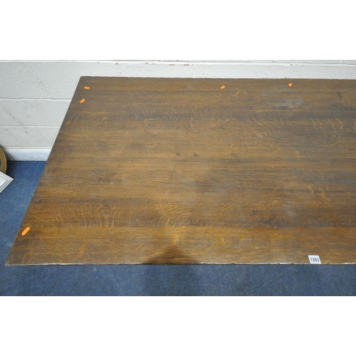 1263 - A 20TH CENTURY SOLID OAK RECTANGULAR TABLE, raised on block and turned legs, united by a stretcher, ... 