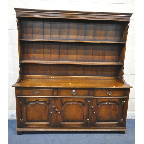 1266 - IN THE MANNER OF TITCHMARSH AND GOODWIN, A 20TH CENTURY SOLID OAK DRESSER, the three tier plate rack... 